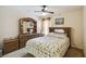 Bedroom showcasing wood furniture and a comfy bed with a patterned blanket at 1706 Tressel Ct, Winter Haven, FL 33881