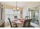 Bright breakfast nook featuring large window and sliding door, creating a cheerful space to enjoy meals at 1706 Tressel Ct, Winter Haven, FL 33881