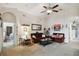 Inviting living room with comfortable seating, carpet, and stylish decor, creating a relaxing space to unwind at 1706 Tressel Ct, Winter Haven, FL 33881