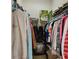 Walk-in closet with ample hanging space and shelving for storage, providing organization at 1706 Tressel Ct, Winter Haven, FL 33881