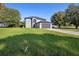 Two-story home with well-kept lawn and a driveway leading to the two-car garage at 186 Rosedale Dr, Deltona, FL 32738