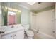 Well-lit bathroom with a shower-tub combo, vanity, and mirror at 2025 Sylvester Rd # N106, Lakeland, FL 33803