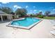 Enjoy the Florida sun in this spacious community pool with lounge chairs and a covered seating area at 2025 Sylvester Rd # N106, Lakeland, FL 33803