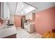 Kitchen featuring white appliances, white cabinets and tile flooring at 2025 Sylvester Rd # N106, Lakeland, FL 33803