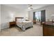 Serene bedroom with a ceiling fan, natural light, and neutral decor creates a relaxing atmosphere at 2027 Airedale Way, Lake Alfred, FL 33850