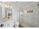 Bright bathroom with a glass shower, granite countertop, and modern fixtures at 2161 Maple Hill Ct, Lakeland, FL 33811