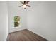 Well-lit bedroom with wood-look floors and a large window at 2161 Maple Hill Ct, Lakeland, FL 33811