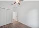 Bright bedroom with a ceiling fan, closet and wood-look floors at 2161 Maple Hill Ct, Lakeland, FL 33811