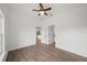 Bright bedroom with a ceiling fan and wood-look floors at 2161 Maple Hill Ct, Lakeland, FL 33811