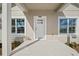 Close up of front porch with white trim, front door, and house number 2161 at 2161 Maple Hill Ct, Lakeland, FL 33811