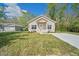 Charming single-story home with a well-manicured lawn and a modern design at 2161 Maple Hill Ct, Lakeland, FL 33811