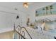 Bright bedroom featuring ceiling fan, closet and an iron bed frame with decorative pillows and patterned bedspread at 2173 Mission Hills Dr, Lakeland, FL 33810