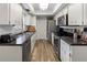 Bright kitchen featuring stainless steel appliances, ample counter space, and white cabinets at 2326 Eastmeadows Rd, Lakeland, FL 33812