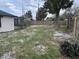 Large backyard with mature trees and a wooden fence at 2521 Coral Way, Lakeland, FL 33801