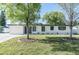 Charming single-story home with a well-maintained lawn and shade trees in a suburban neighborhood at 2521 Coral Way, Lakeland, FL 33801