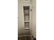 Hallway closet with stylish floating shelves and new paint at 2521 Coral Way, Lakeland, FL 33801