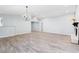 Spacious living room with vaulted ceiling, recessed lighting and stylish chandelier providing plenty of space and light at 2521 Coral Way, Lakeland, FL 33801