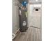 This is an image of a newer water heater in a home available for sale at 2521 Coral Way, Lakeland, FL 33801