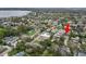 Aerial view of neighborhood, near a body of water, with mature tree coverage and various architectural styles at 2616 Fairmount Ave, Lakeland, FL 33803