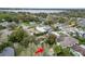 Aerial view of home in mature neighborhood close to a large body of water with a red arrow at 2616 Fairmount Ave, Lakeland, FL 33803