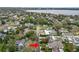 Aerial view of home in mature neighborhood with lush landscaping and tree coverage with a red arrow at 2616 Fairmount Ave, Lakeland, FL 33803