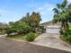 Charming single-story home featuring a stucco exterior, well-manicured lawn, and an attached two-car garage at 2616 Fairmount Ave, Lakeland, FL 33803