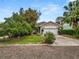 Charming single-story home with a well-manicured lawn and mature trees, perfect for suburban living at 2616 Fairmount Ave, Lakeland, FL 33803