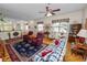 Open living area featuring comfortable seating, decorative area rug, and view of the kitchen at 2616 Fairmount Ave, Lakeland, FL 33803