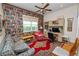 This office features built-in shelving, a patterned rug, and a comfortable seating area at 2616 Fairmount Ave, Lakeland, FL 33803