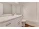 Renovated bathroom features a subway tile shower and marble countertop at 2638 Ralph Rd, Lakeland, FL 33801