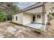 Charming home featuring a covered porch, black front door, and neutral siding, complemented by fresh landscaping at 2638 Ralph Rd, Lakeland, FL 33801