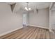 Hallway showcasing wood flooring with access to a doorway at 2638 Ralph Rd, Lakeland, FL 33801