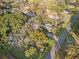 An aerial of a lush green property including trees and home at 2714 Golfview St, Lakeland, FL 33801