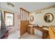 Charming bathroom featuring twin sinks, wood trim, and decorative wallpaper at 2714 Golfview St, Lakeland, FL 33801