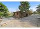 Quaint outdoor building with a screened-in porch and a lush landscape with a concrete driveway at 2714 Golfview St, Lakeland, FL 33801