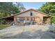 Exterior features concrete area, grill, and a covered carport on the side of the home at 2714 Golfview St, Lakeland, FL 33801