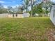 Large backyard showcasing a shed and ample green space with potential for gardening and recreation at 3023 Maplewood Ave, Lakeland, FL 33803