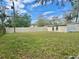 Fenced backyard featuring a shed offering extra storage space and room for outdoor activities at 3023 Maplewood Ave, Lakeland, FL 33803