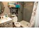 Cozy bathroom featuring a gray tiled shower and a charming paris themed shower curtain at 304 Olmo Ct, Winter Haven, FL 33880