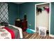 Bedroom featuring a closet, and a bed with a patterned cover, and a vintage desk at 304 Olmo Ct, Winter Haven, FL 33880