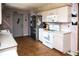 Appliance view of the kitchen with white cabinets and tile floor at 304 Olmo Ct, Winter Haven, FL 33880