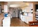 View of the kitchen showcasing white cabinets, modern appliances, and tile floor at 304 Olmo Ct, Winter Haven, FL 33880