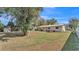 Spacious backyard showcasing well-maintained landscaping and various recreational areas with room to roam at 3207 S Polk Ave, Lakeland, FL 33803