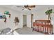 Bedroom featuring crib, storage and neutral colored walls at 3207 S Polk Ave, Lakeland, FL 33803