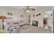 Brightly decorated Bedroom featuring crib, chair, changing table and rainbow wall decor at 3207 S Polk Ave, Lakeland, FL 33803