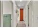 Hallway with neutral tile floor, linen closet and doorway to the bathroom at 3207 S Polk Ave, Lakeland, FL 33803