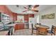 An airy eat-in kitchen featuring stainless appliances, tile floors, and a ceiling fan at 3207 S Polk Ave, Lakeland, FL 33803