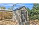 Durable storage shed with double doors, offering ample space and secure organization in the backyard at 3207 S Polk Ave, Lakeland, FL 33803