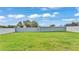 Spacious backyard with lush green grass and a privacy fence at 3224 Pearly Dr, Lakeland, FL 33812