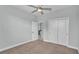 Bright bedroom featuring neutral carpet, ceiling fan, and a closet for ample storage space at 3224 Pearly Dr, Lakeland, FL 33812